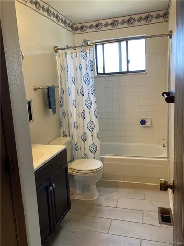 a bathroom with a toilet a sink and a bathtub