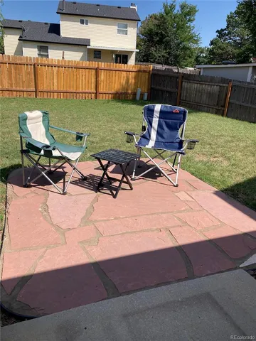 a view of a chairs and table on the terrace