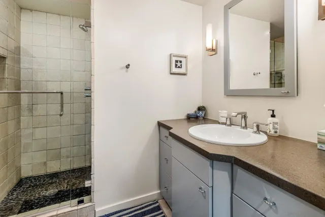 a bedroom with a bed and a couch