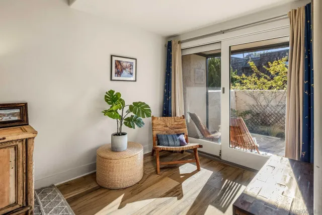 a view of a garden with a building in the background