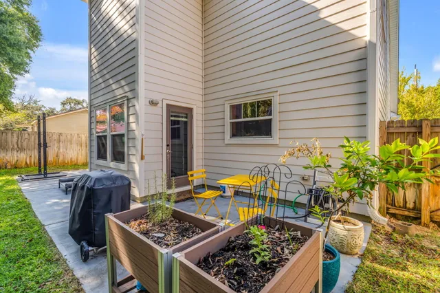 a view of a chairs and table in the patio