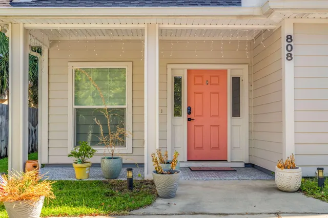 a front view of a house with outdoor seating