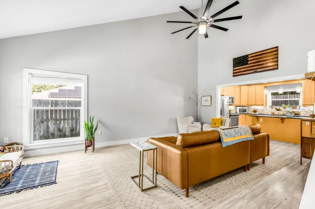 a living room with furniture and a large window