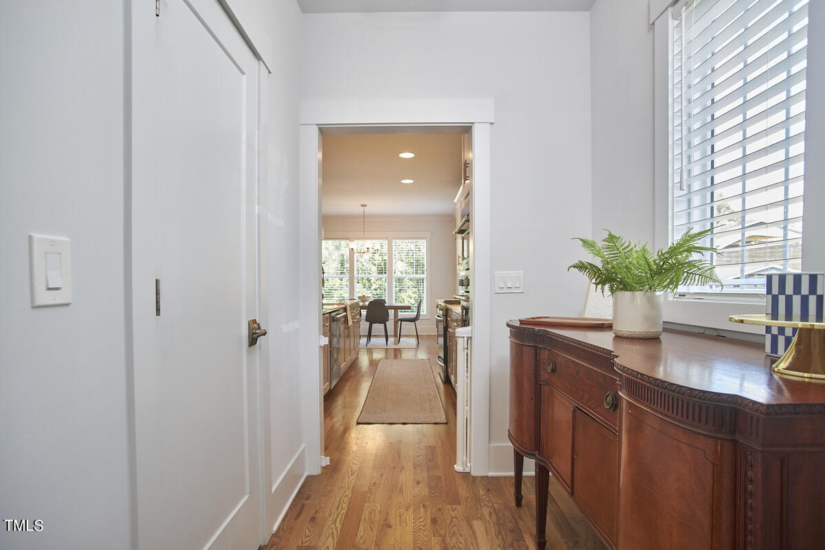 1019 Glascock Street Raleigh, NC 27610 - Photo 13 of 45 a dining room with furniture and wooden floor