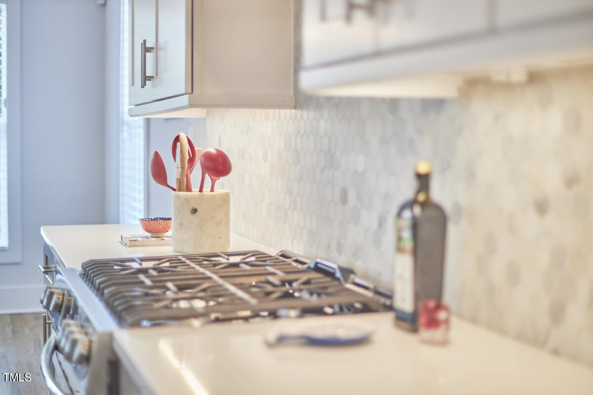 1019 Glascock Street Raleigh, NC 27610 - Photo 16 of 45 a bedroom with a bed and a cabinets