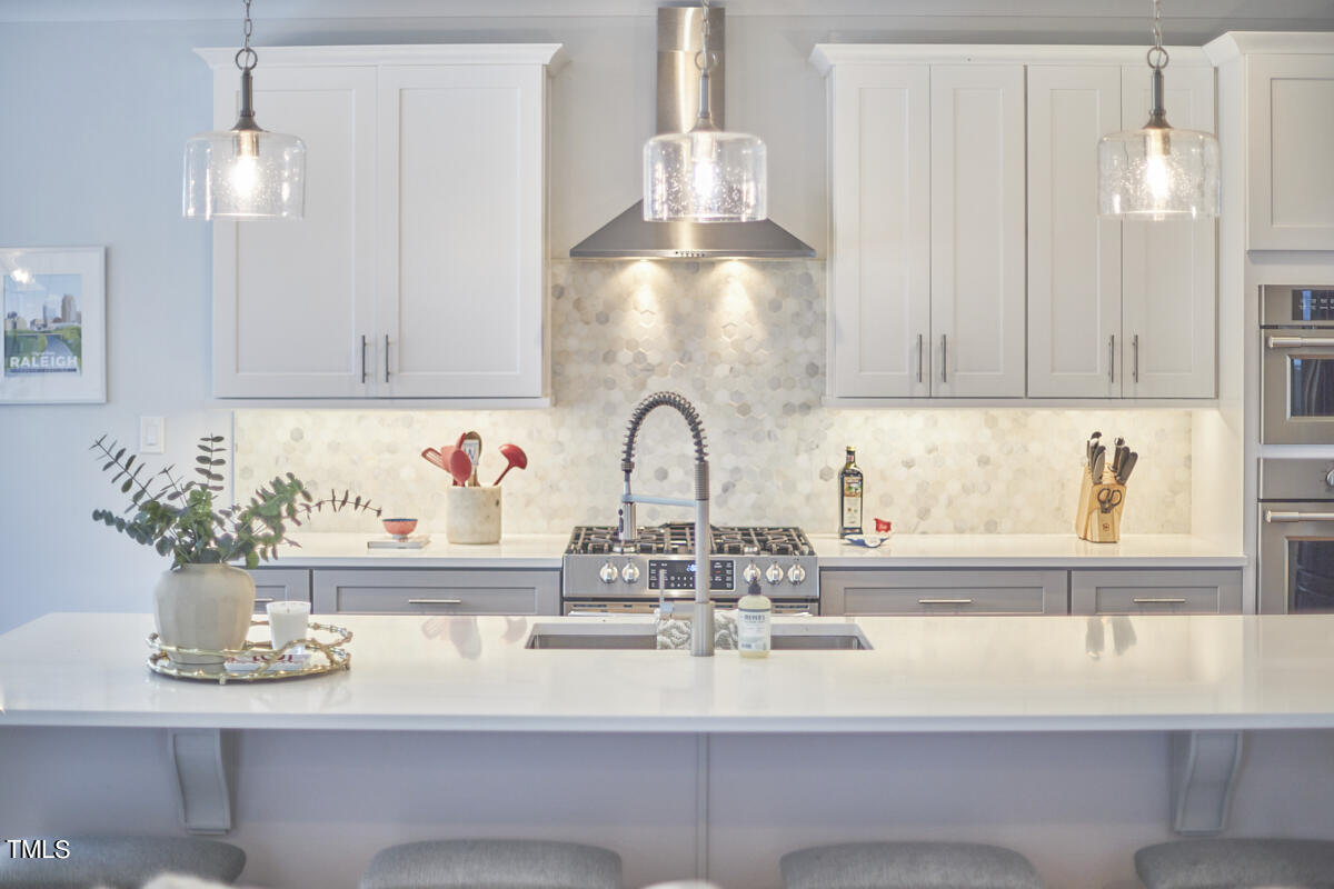 1019 Glascock Street Raleigh, NC 27610 - Photo 17 of 45 a kitchen with a sink and cabinets