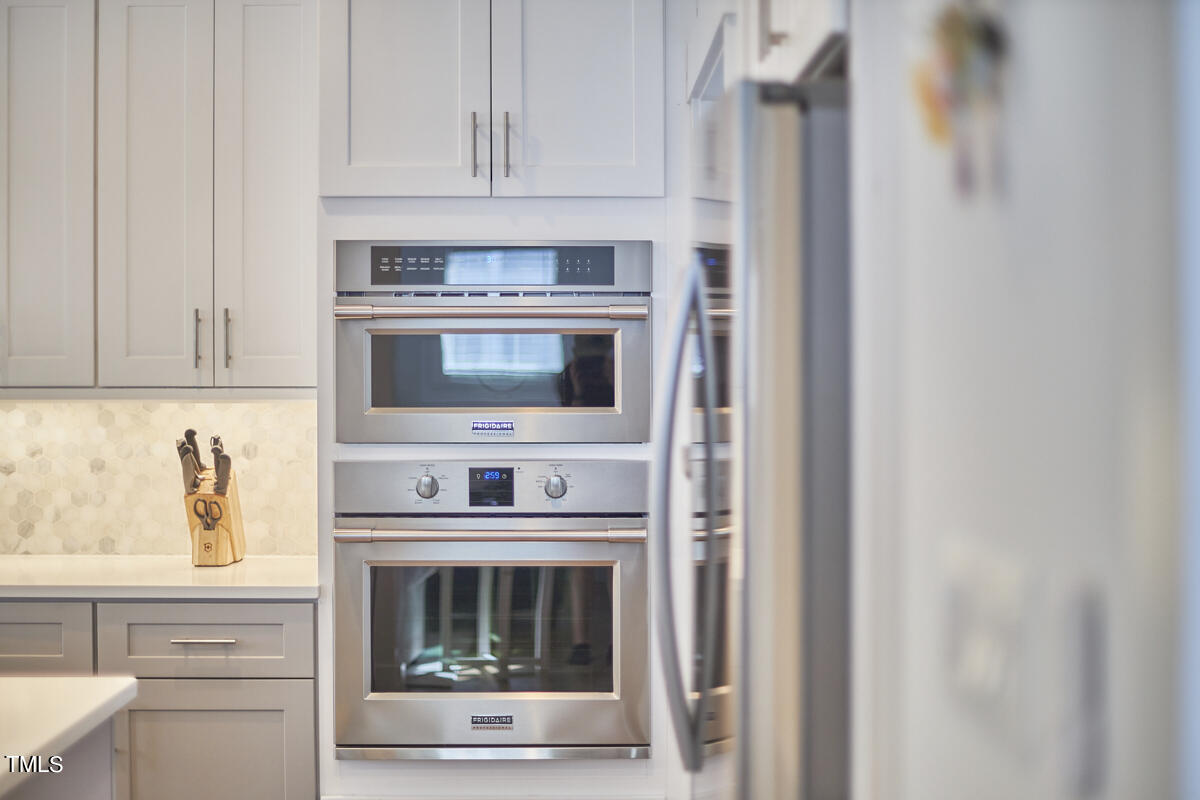 1019 Glascock Street Raleigh, NC 27610 - Photo 18 of 45 a stove top oven sitting inside of a kitchen