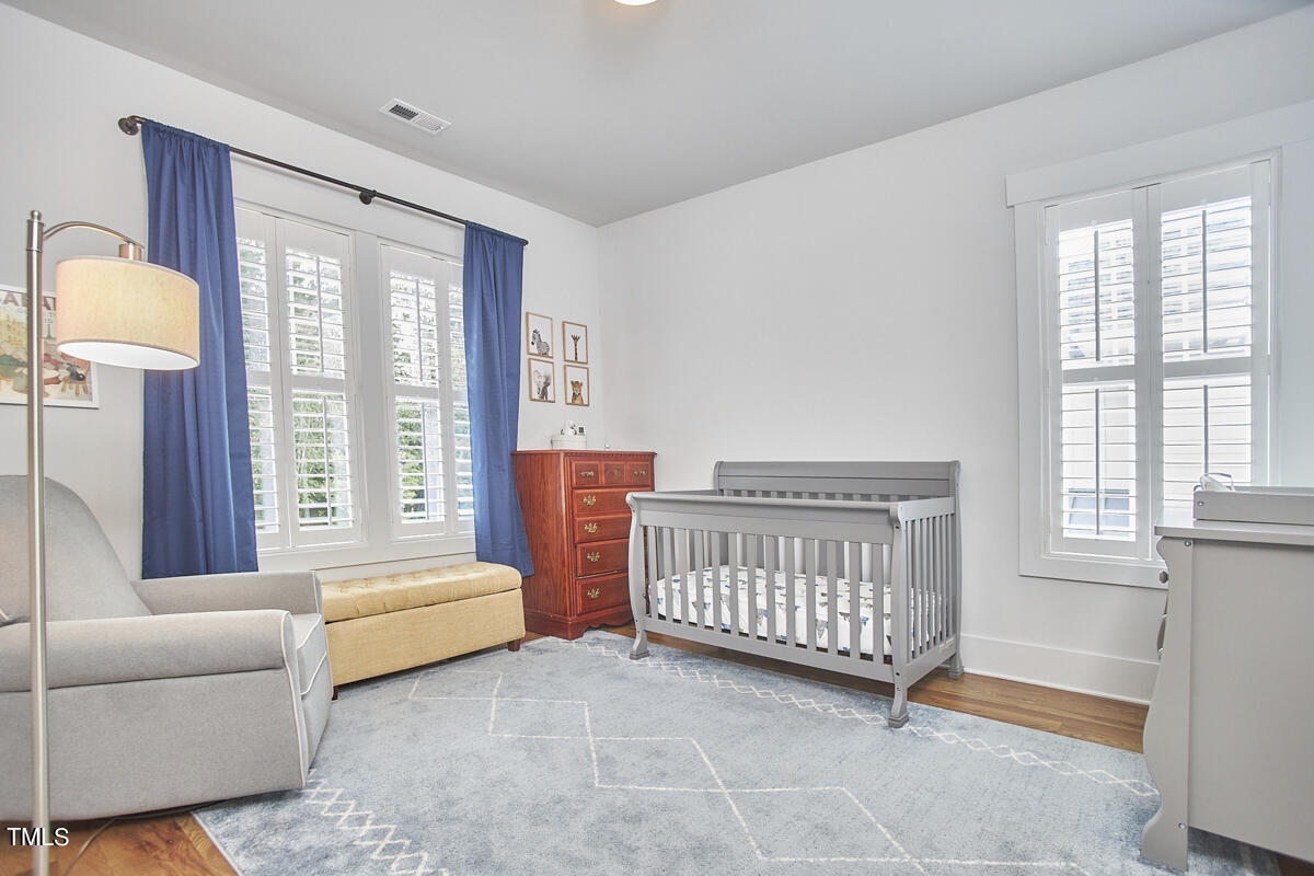 1019 Glascock Street Raleigh, NC 27610 - Photo 39 of 45 a bedroom with furniture and a window