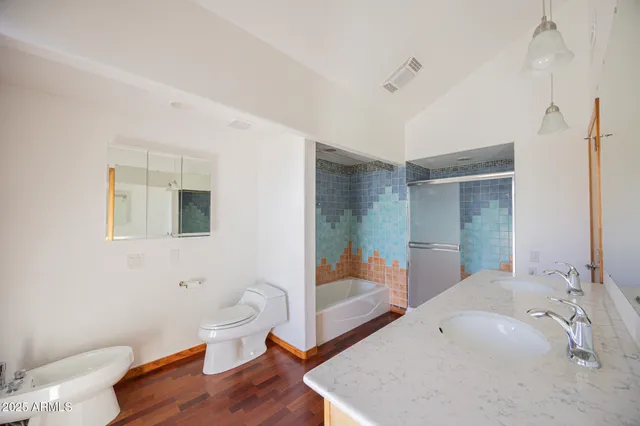 a bathroom with a sink and toilet