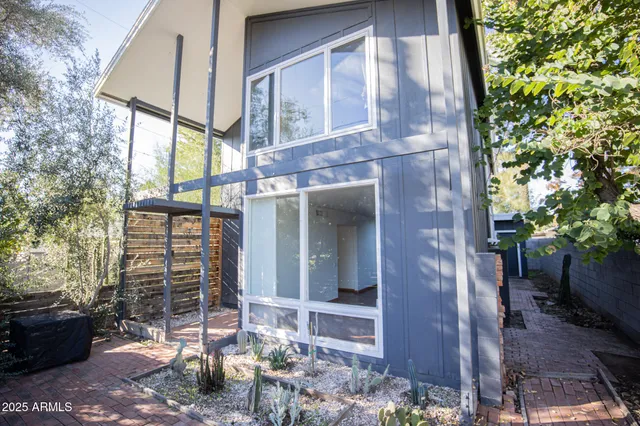 a view of a brick house with a large windows