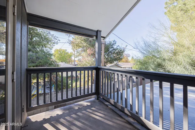 a view of a wooden balcony with a swing