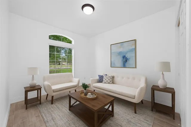 a living room with furniture and a window