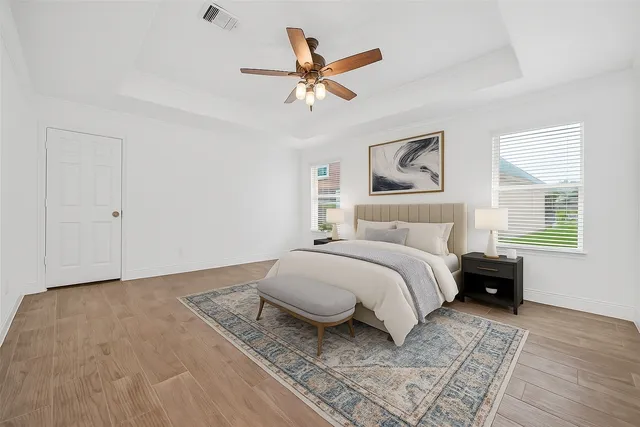 a view of a room with wooden floor