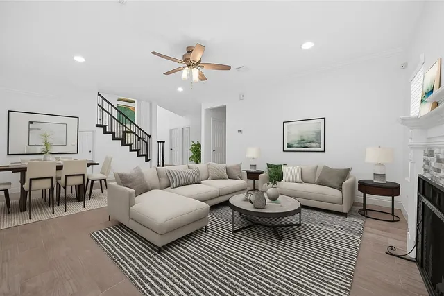 a living room with furniture a rug and a chandelier
