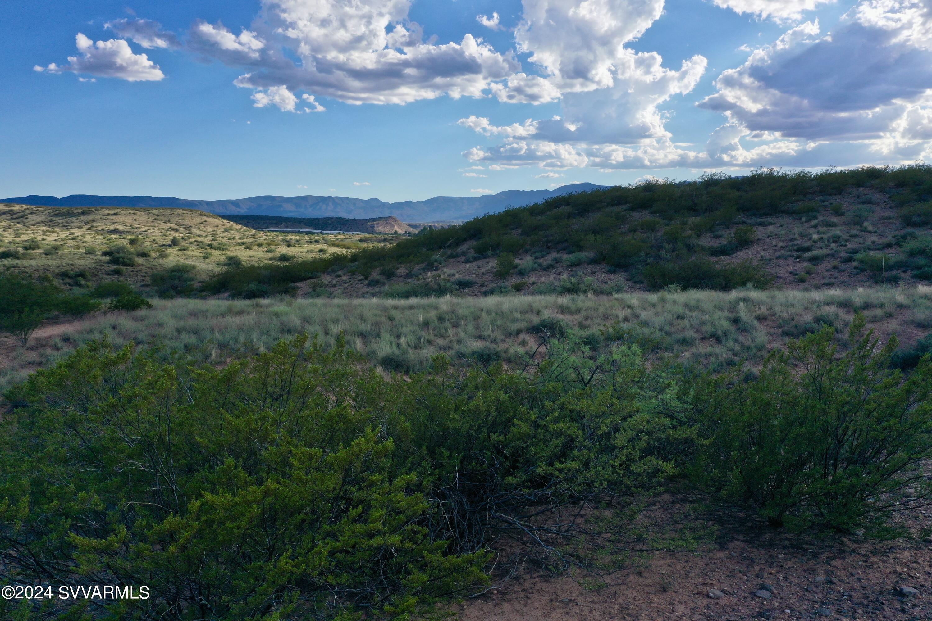 11675 Diamond Vw Road Cornville, AZ 86325 - Photo 19 of 24 a view of a big yard with lots of green space and mountain view