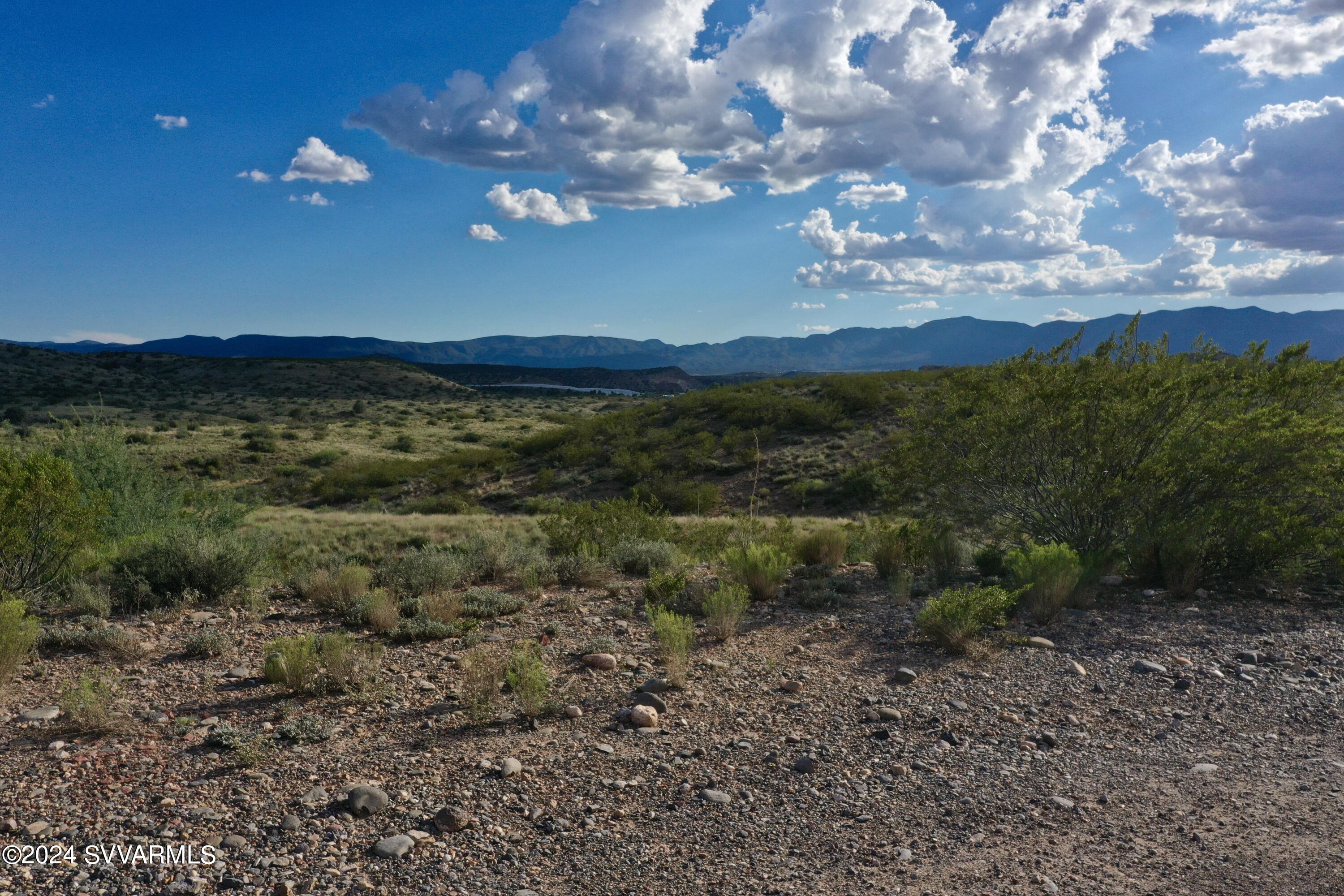 11675 Diamond Vw Road Cornville, AZ 86325 - Photo 21 of 24 a view of a big yard with lots of green space and mountain view