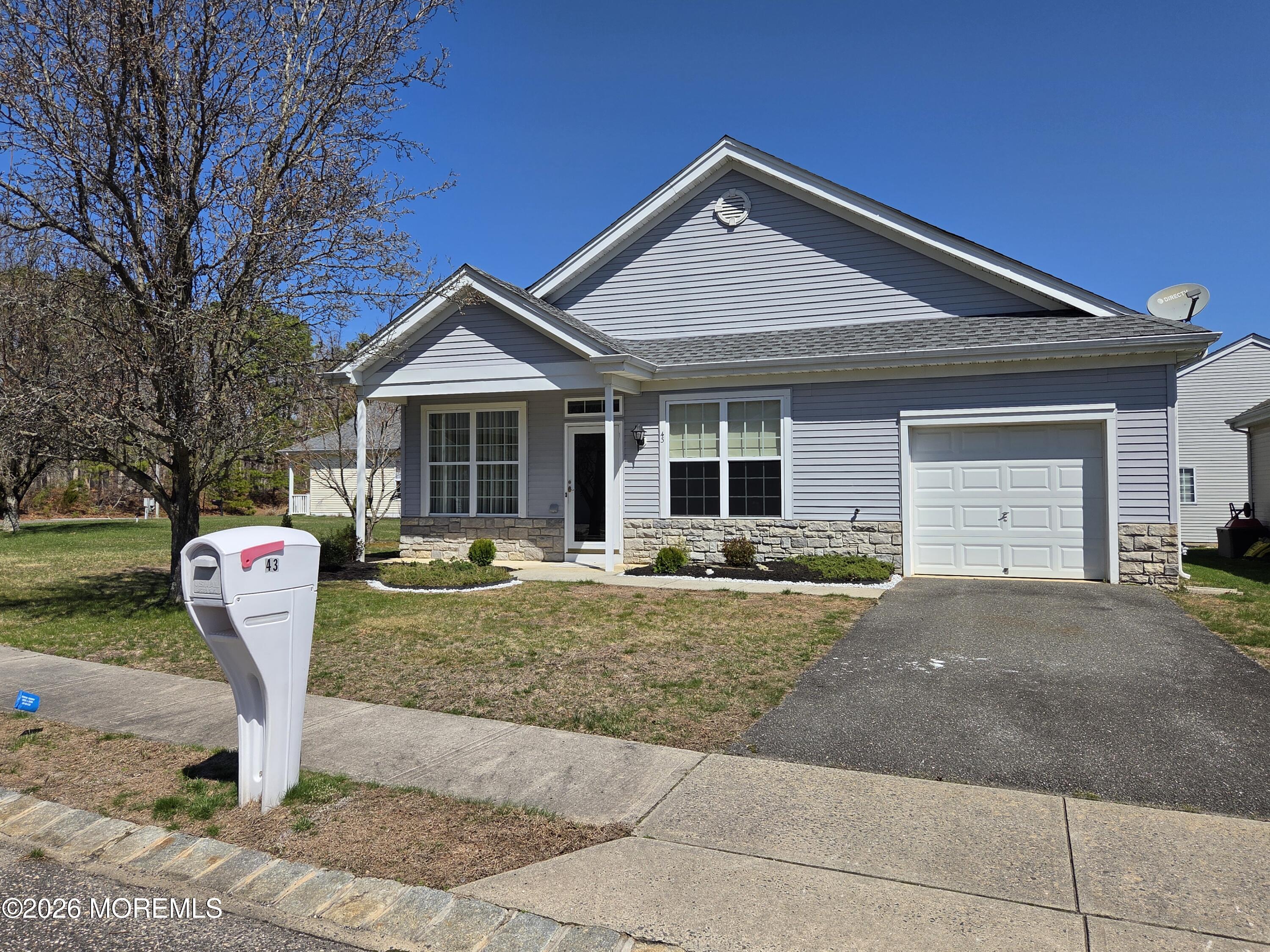 43 Osprey Place Barnegat, NJ 08005 - Photo 1 of 34 a front view of a house with a yard