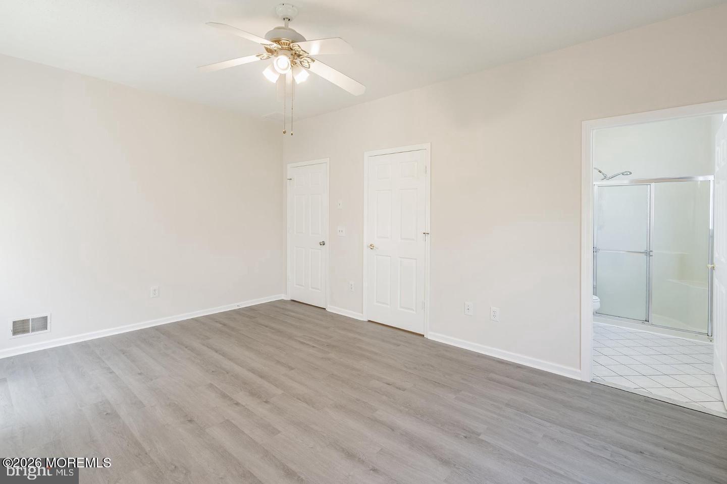 43 Osprey Place Barnegat, NJ 08005 - Photo 23 of 34 a view of a room with wooden floor and a ceiling fan