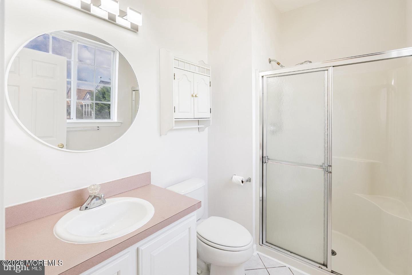 43 Osprey Place Barnegat, NJ 08005 - Photo 26 of 34 a bathroom with a granite countertop sink toilet a mirror and shower