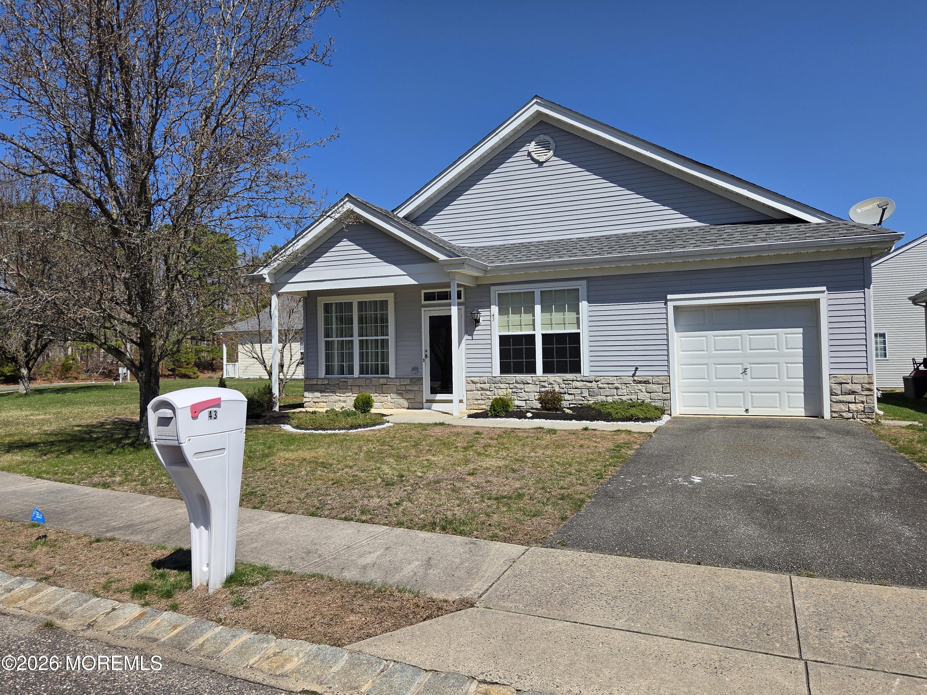43 Osprey Place Barnegat, NJ 08005 - Photo 5 of 34 a front view of a house with a yard