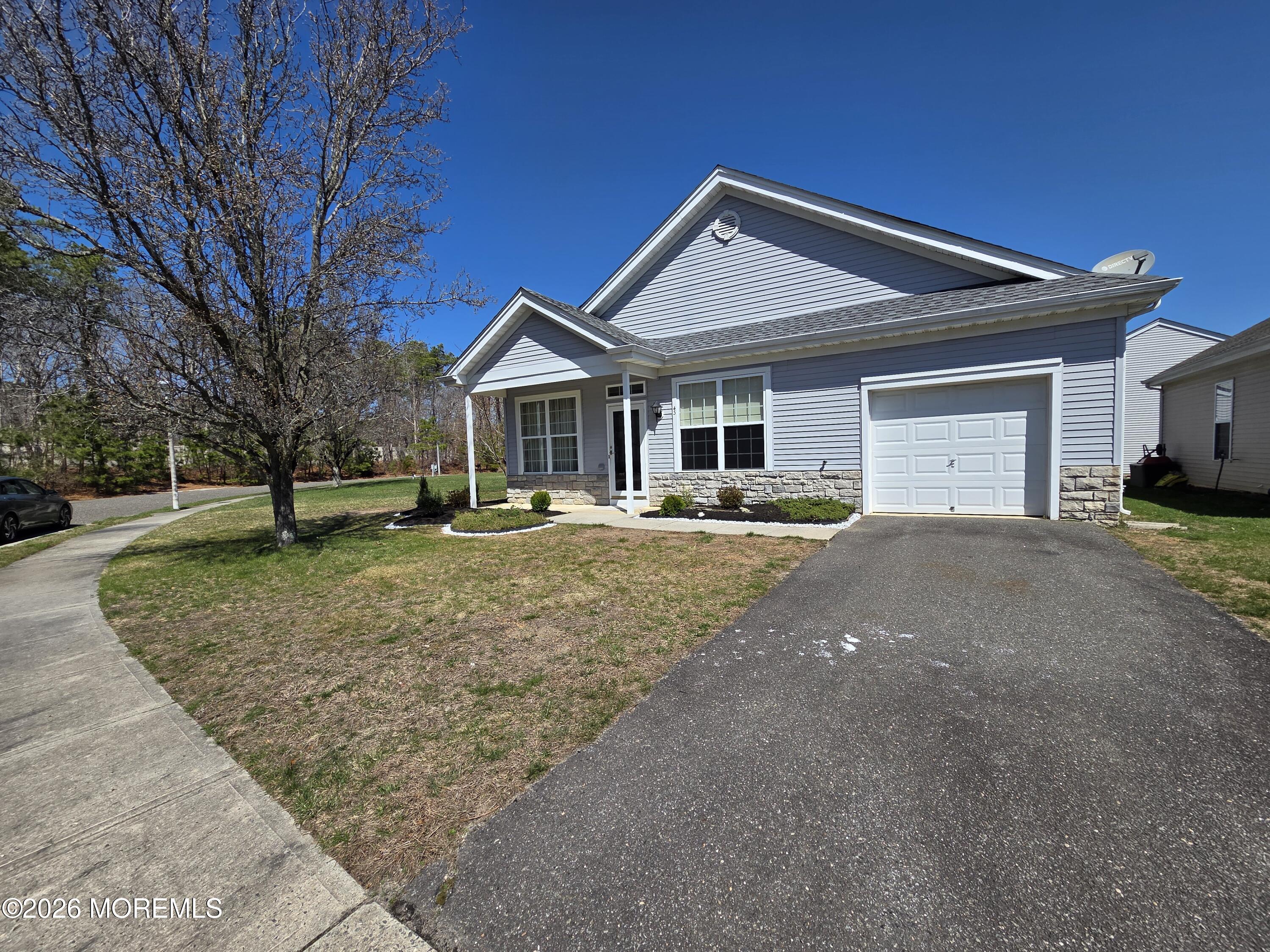 43 Osprey Place Barnegat, NJ 08005 - Photo 6 of 34 a front view of a house with a yard