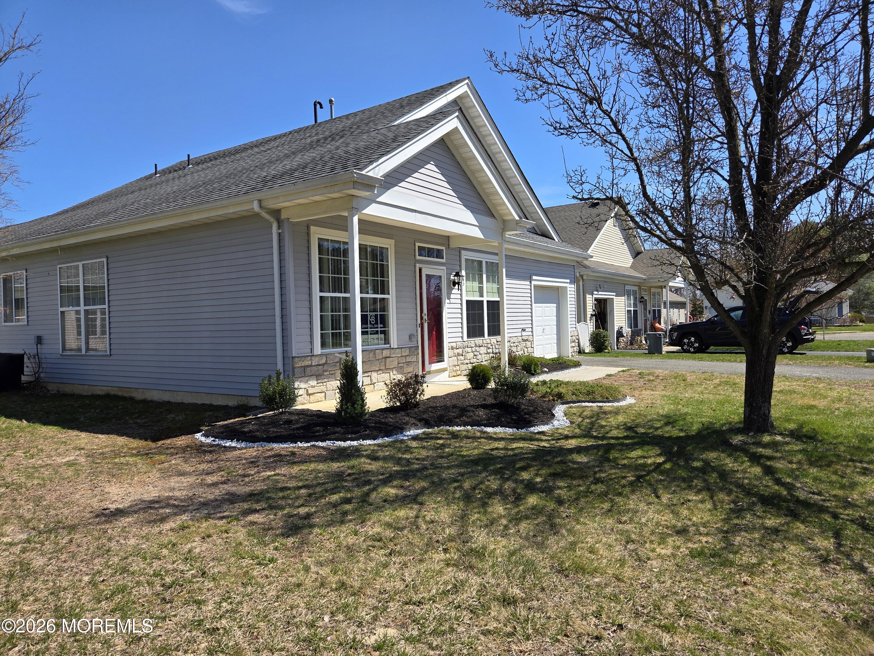 43 Osprey Place Barnegat, NJ 08005 - Photo 7 of 34 a front view of a house with garden