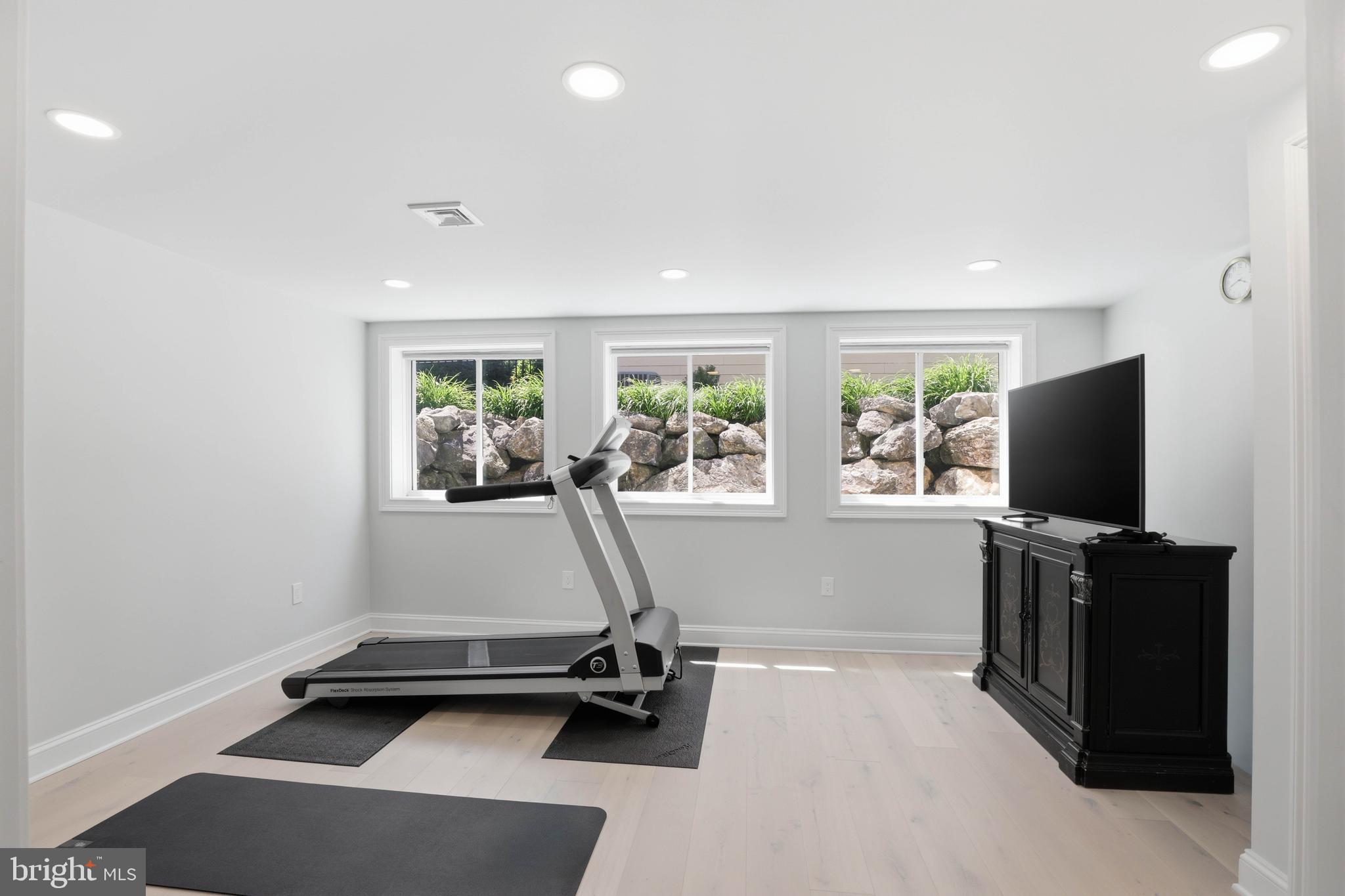 360 Addison Place Lancaster, PA 17601 - Photo 60 of 78 a room with gym equipment and a flat screen tv