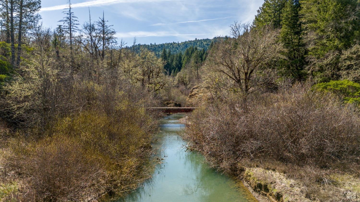 a view of lake with a yard