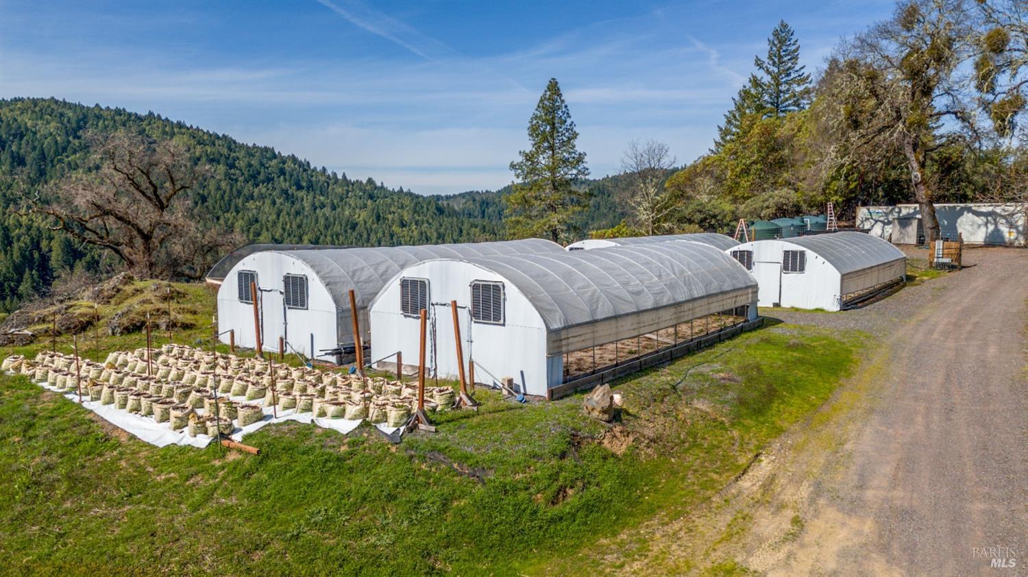 20401 Tomki Road Redwood Valley, CA 95470 - Photo 24 of 35 a front view of a house with garden
