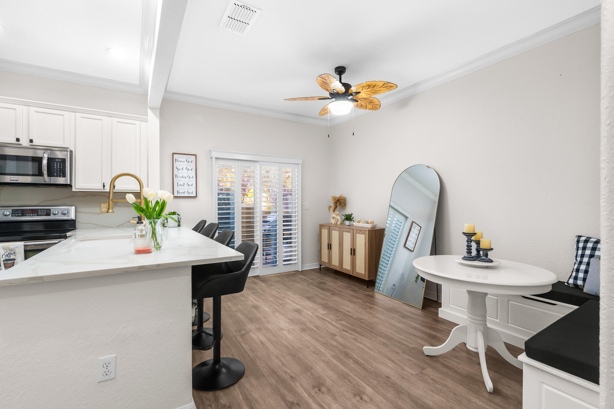 155 Monterey Bay Drive Boynton Beach, FL 33426 - Photo 11 of 37 a view of a workspace with furniture and a chandelier