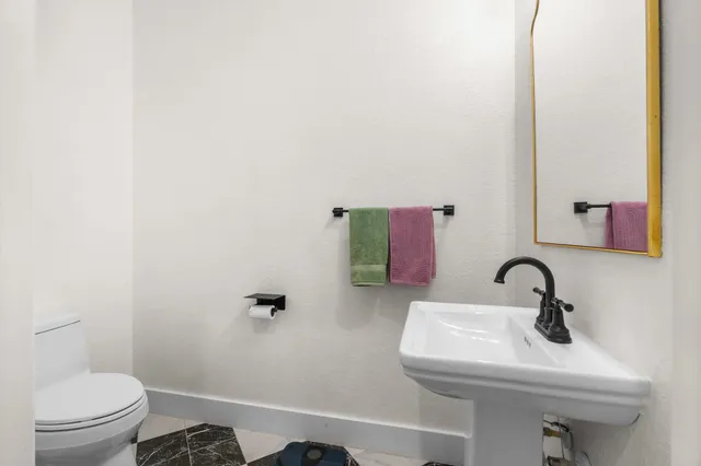 a bathroom with a sink and a toilet