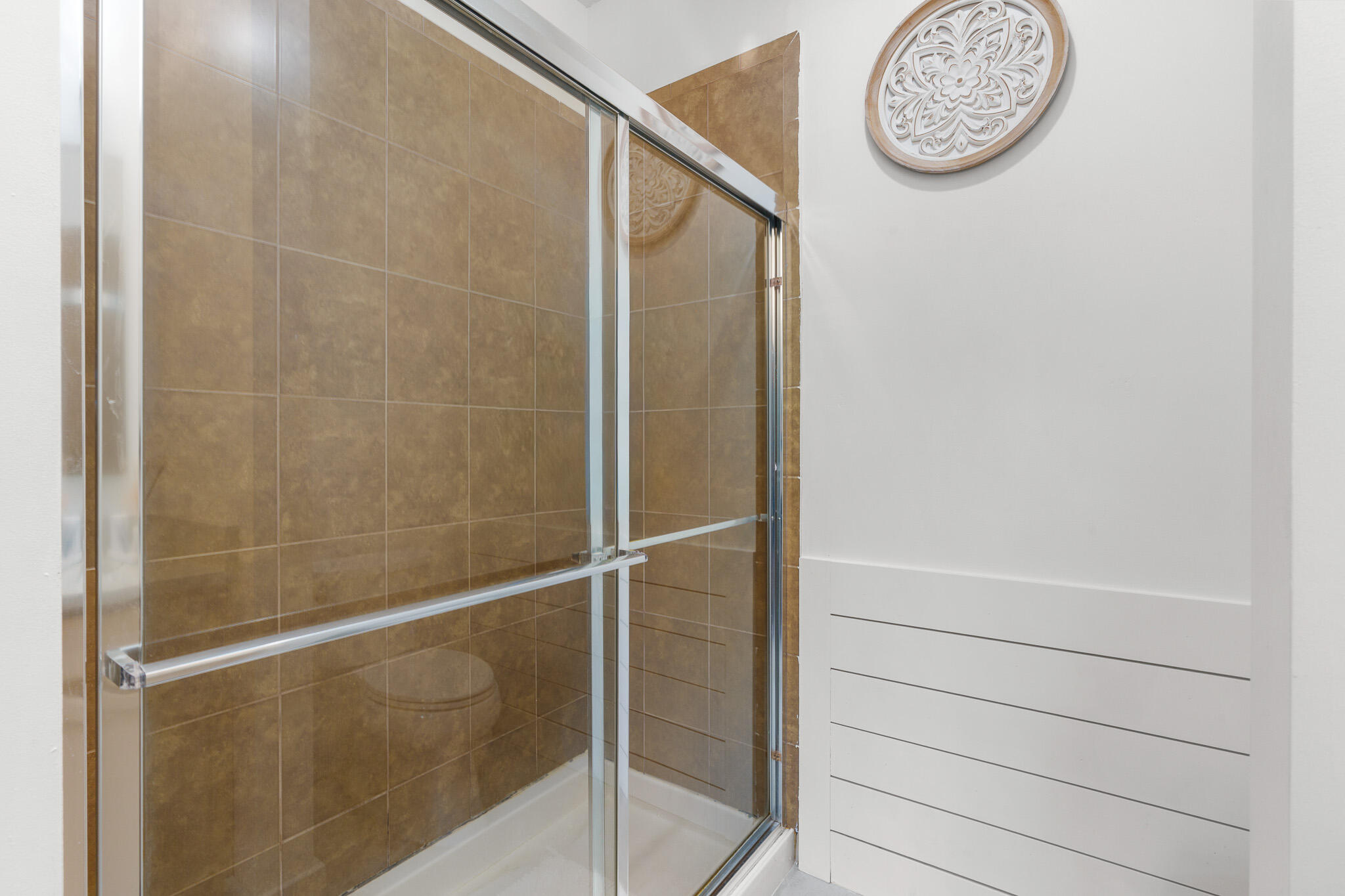 155 Monterey Bay Drive Boynton Beach, FL 33426 - Photo 22 of 37 a bathroom with a large mirror and a shower