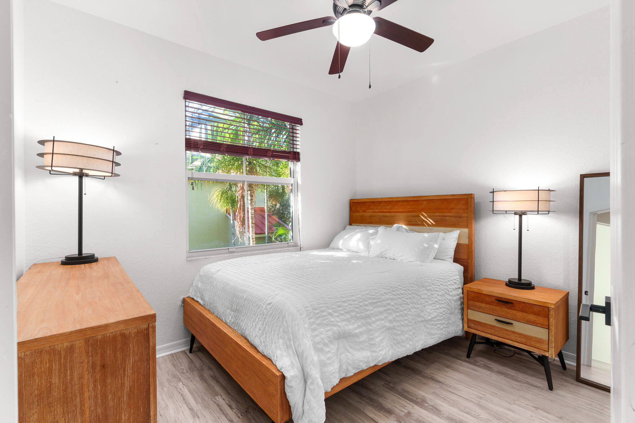 155 Monterey Bay Drive Boynton Beach, FL 33426 - Photo 28 of 37 a bedroom with a bed and a chandelier