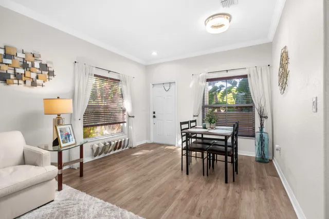 a work room with furniture and wooden floor