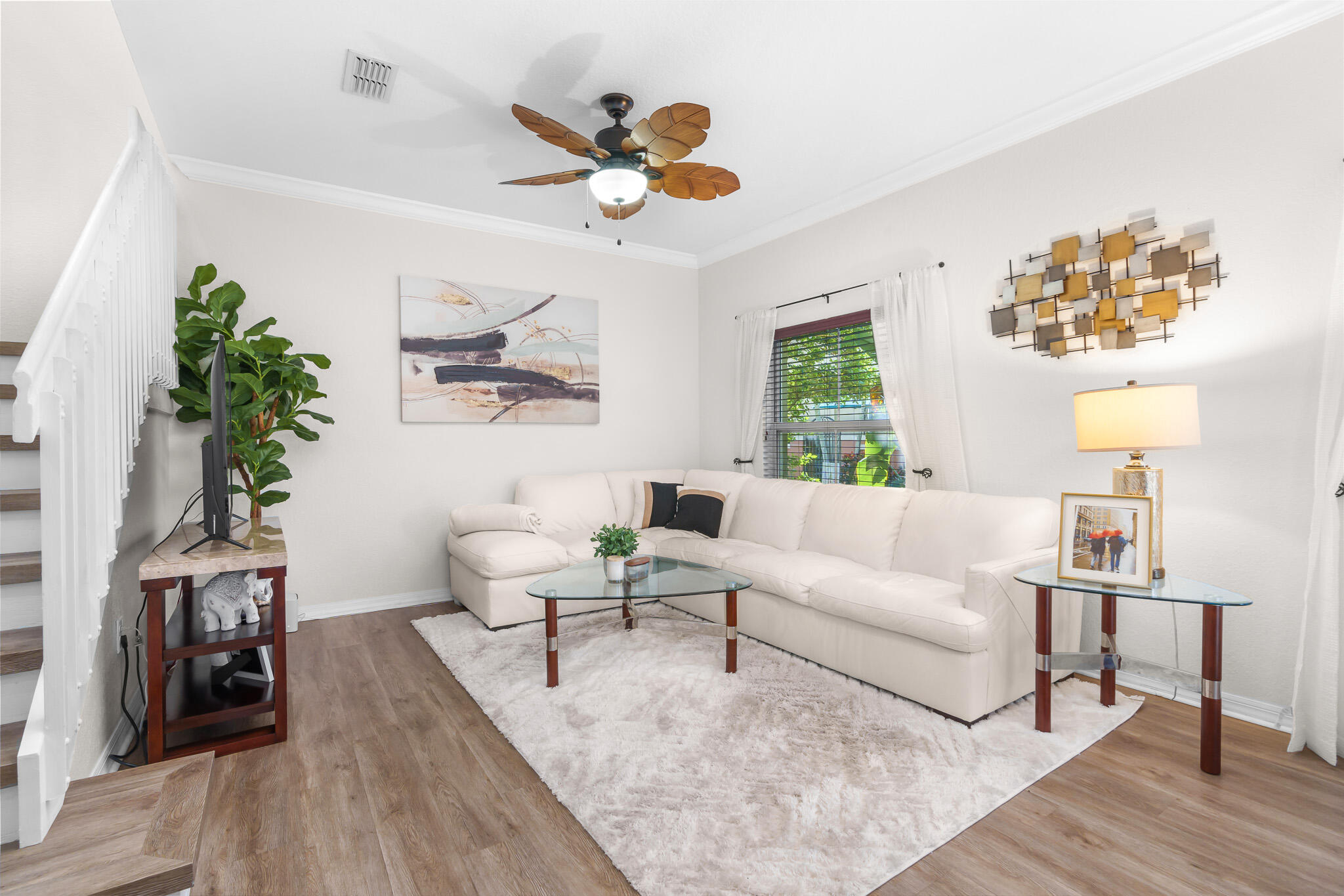 155 Monterey Bay Drive Boynton Beach, FL 33426 - Photo 7 of 37 a living room with couches painting on the wall and a potted plant