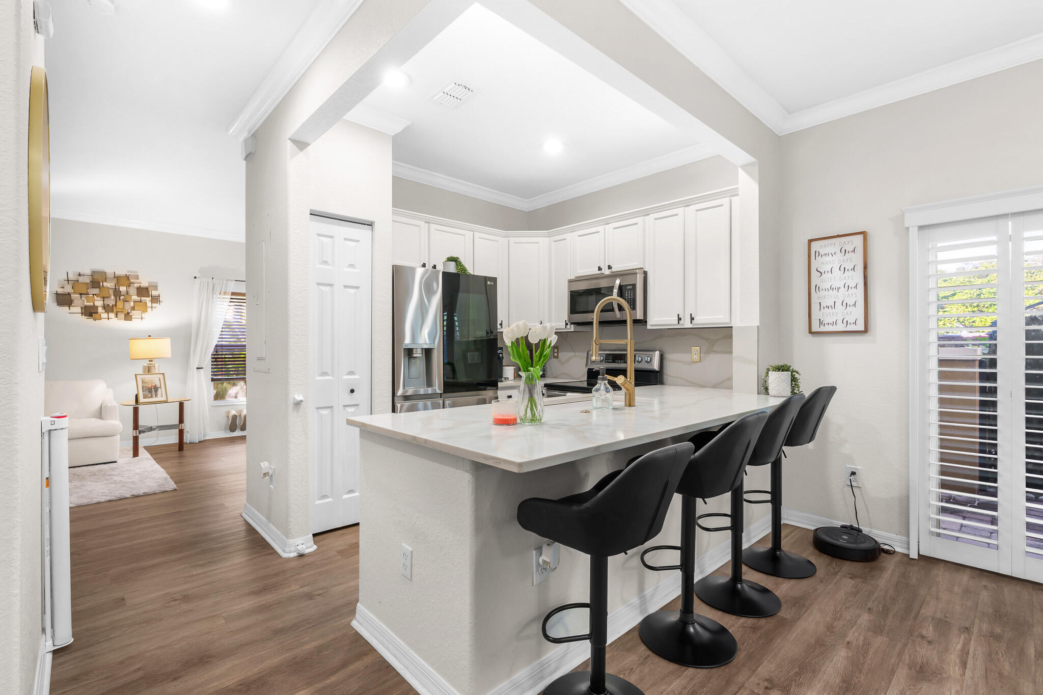 155 Monterey Bay Drive Boynton Beach, FL 33426 - Photo 8 of 37 a view of a dining room with furniture and wooden floor