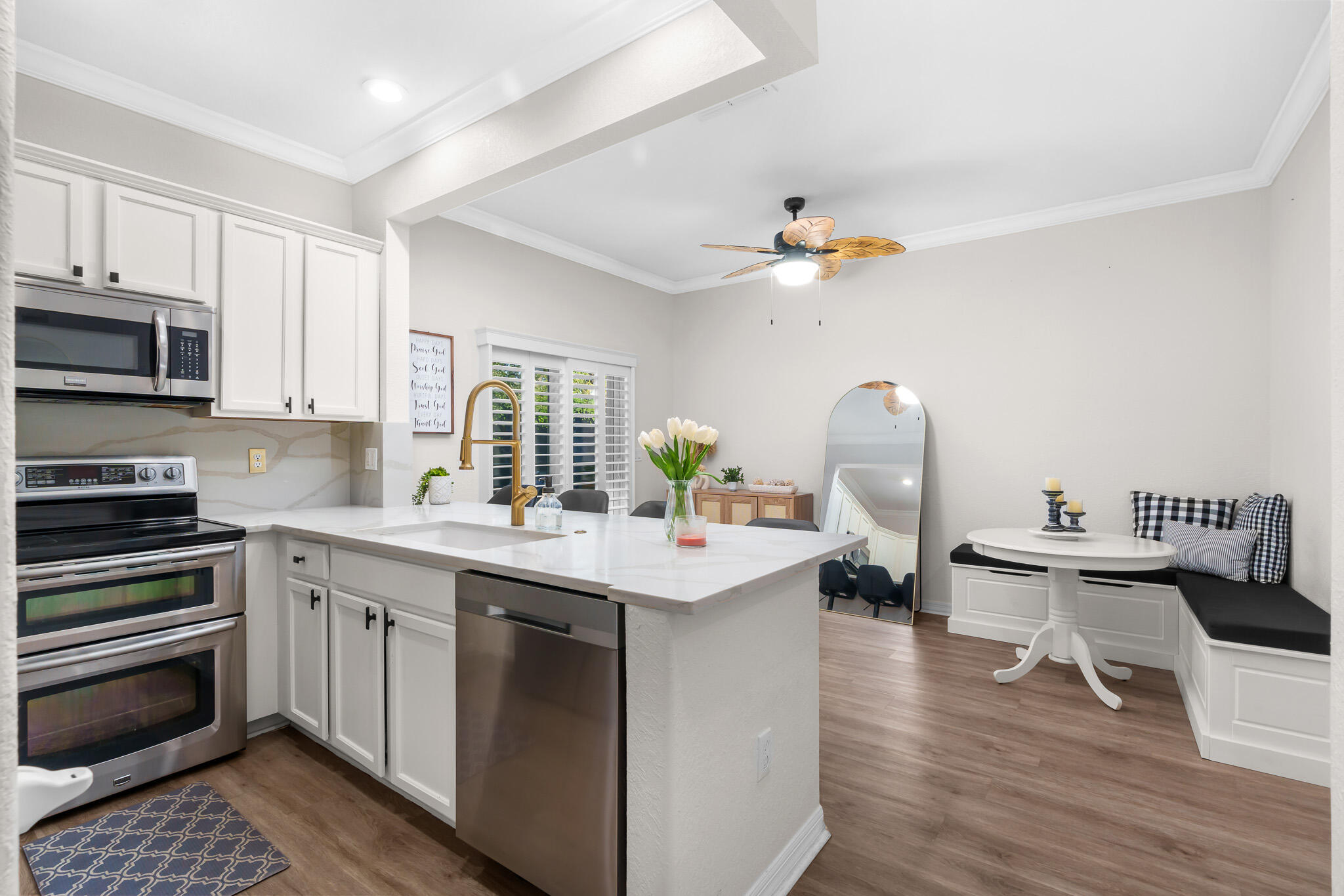 155 Monterey Bay Drive Boynton Beach, FL 33426 - Photo 9 of 37 a kitchen with a sink stove and cabinets