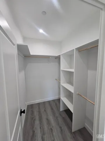 a view of an empty walk in closet