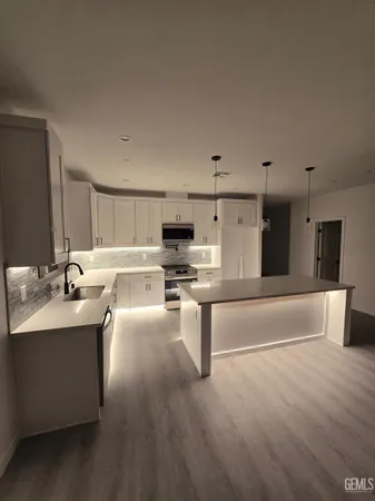 a view of hallway with wooden floor