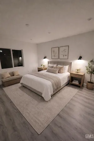 a spacious bathroom with a granite countertop sink and a mirror