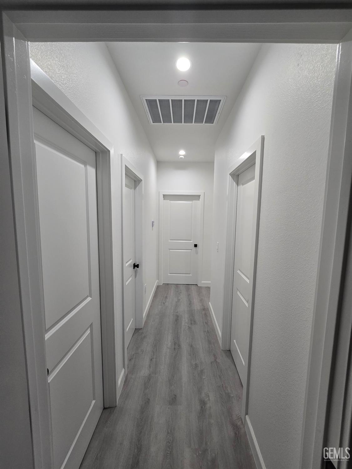 Undisclosed Address California City, CA 93505 - Photo 34 of 41 a view of hallway with wooden floor