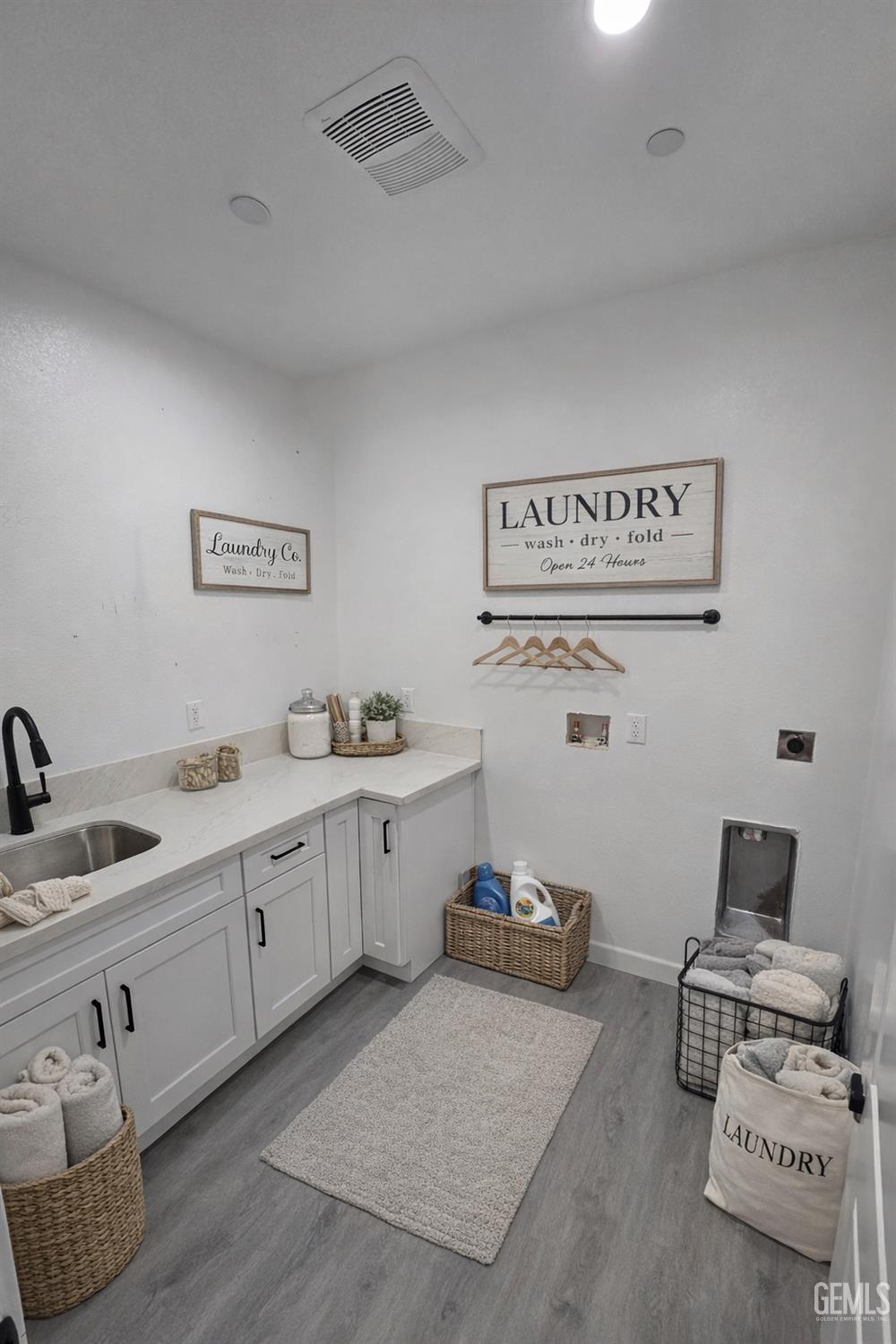 Undisclosed Address California City, CA 93505 - Photo 4 of 41 a spacious bathroom with a granite countertop sink and a mirror