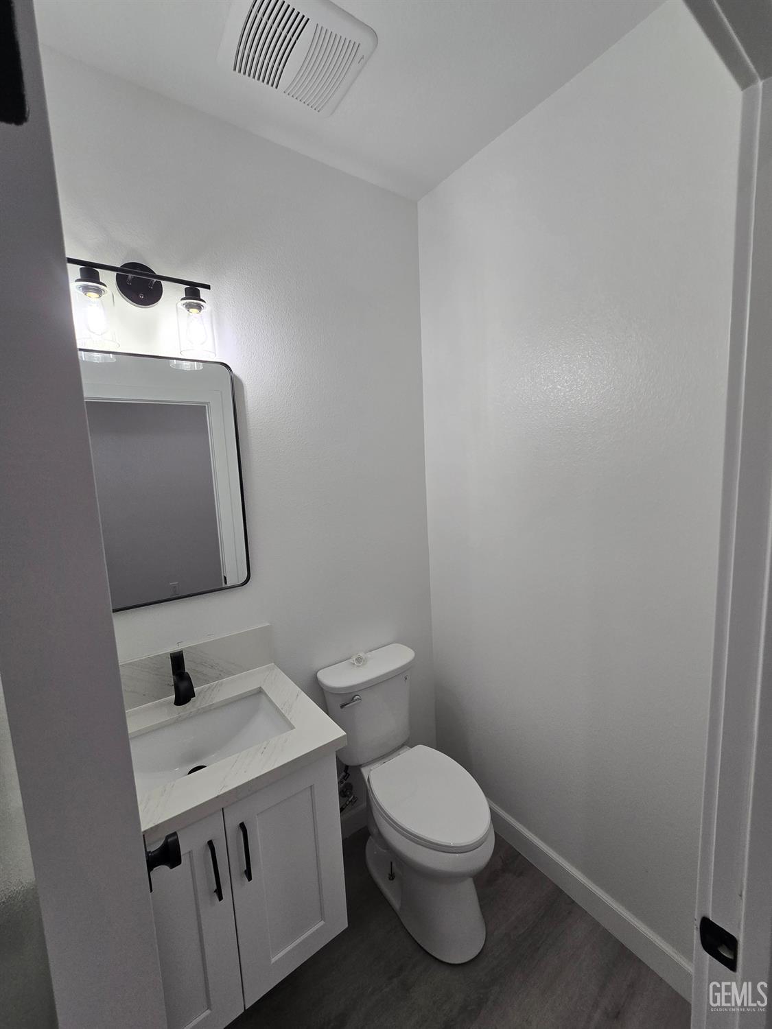 Undisclosed Address California City, CA 93505 - Photo 41 of 41 a bathroom with a toilet sink and mirror