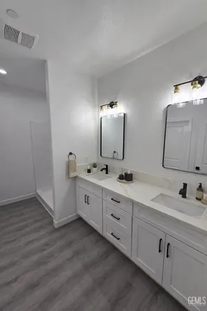 a living room with furniture and a dining table