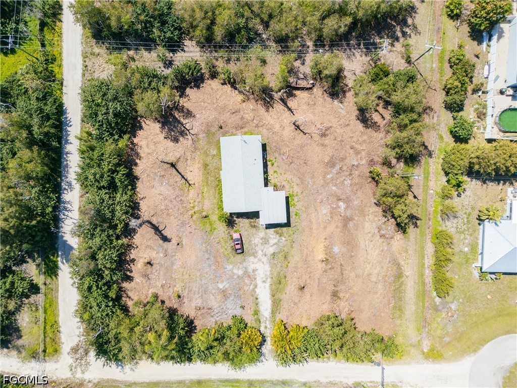 5427 Easy Street Bokeelia, FL 33922 - Photo 3 of 9 an aerial view of residential house with outdoor space