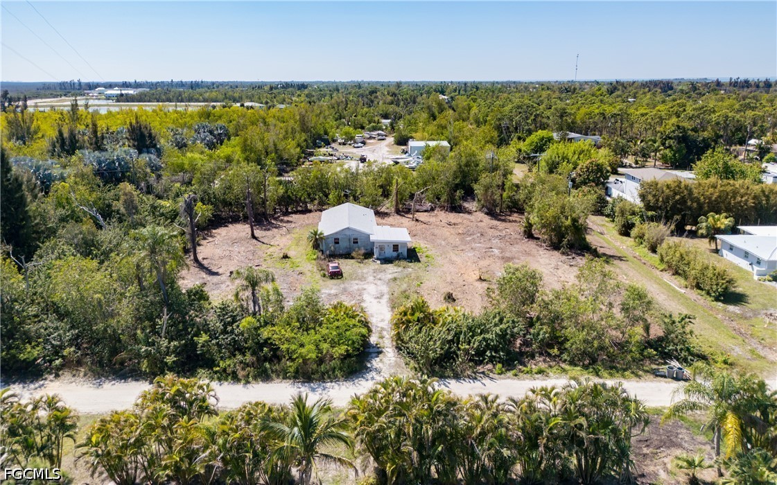 5427 Easy Street Bokeelia, FL 33922 - Photo 8 of 9 an aerial view of residential houses with outdoor space and trees
