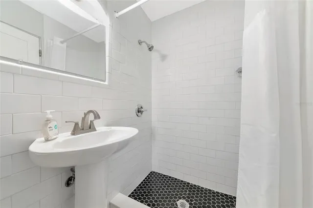 a view of a house with wooden fence