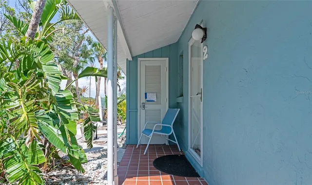 a view of a chairs and table in a backyard