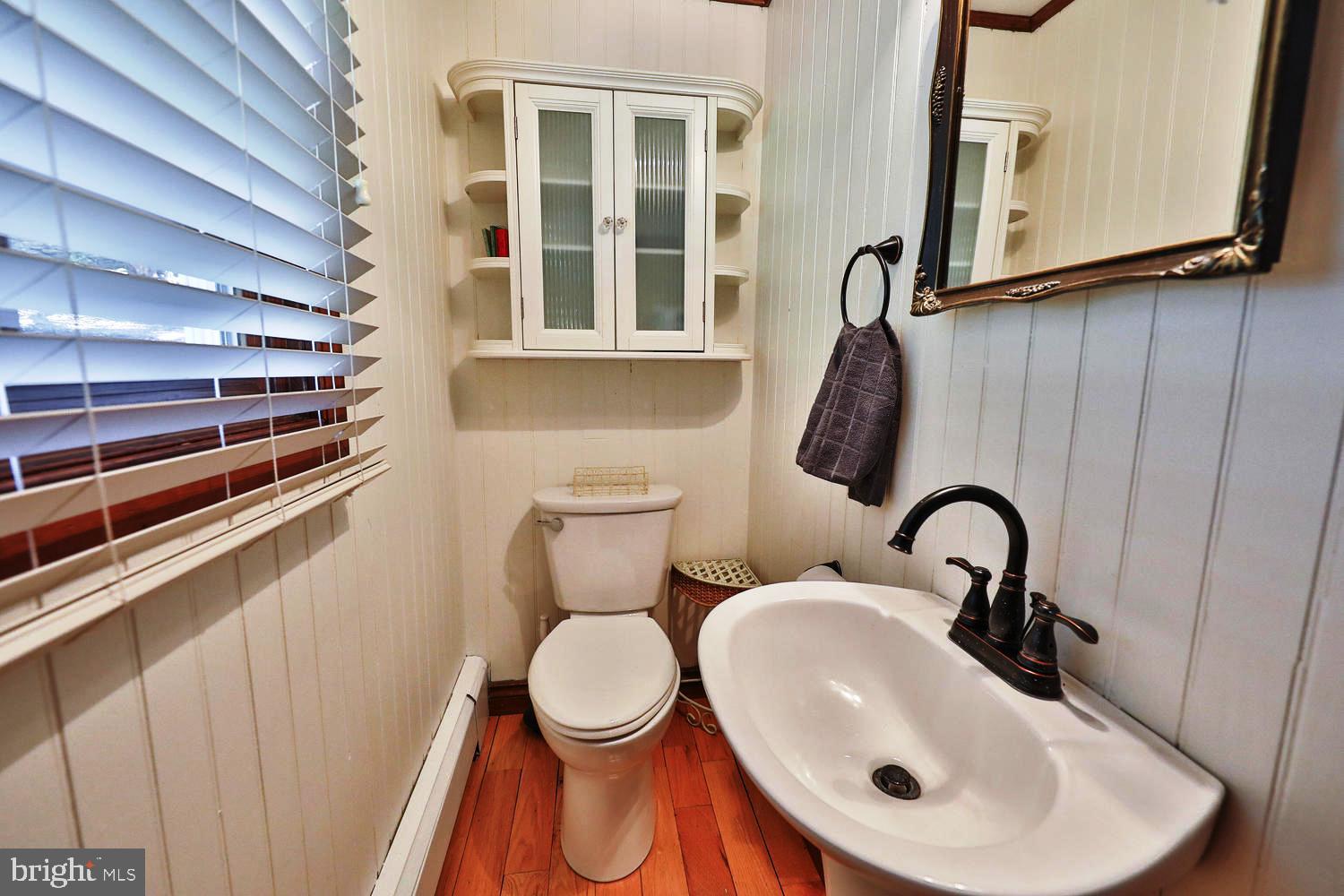 923 Rydal Road Jenkintown, PA 19046 - Photo 13 of 56 a bathroom with a sink and a toilet