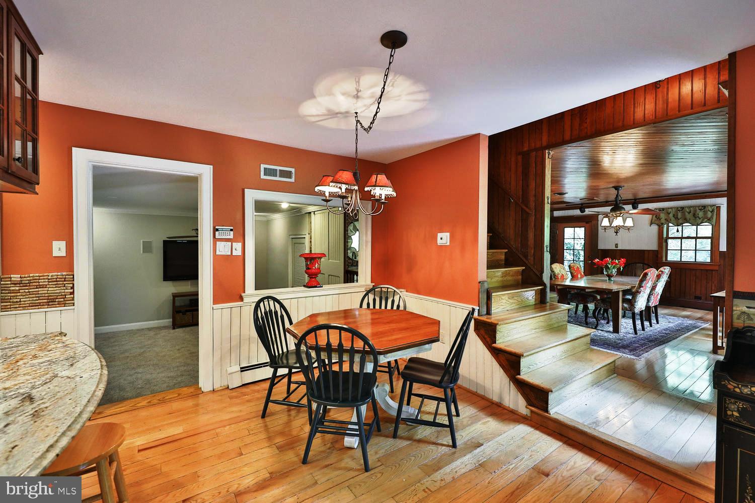 923 Rydal Road Jenkintown, PA 19046 - Photo 14 of 56 a dining room with furniture a chandelier and wooden floor